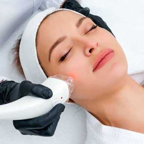 Women getting laser skin treatment