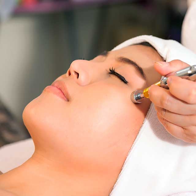 Woman getting skin rejuvenation treatment