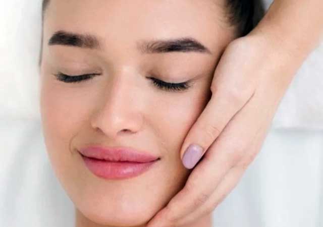 Woman getting soothing facial