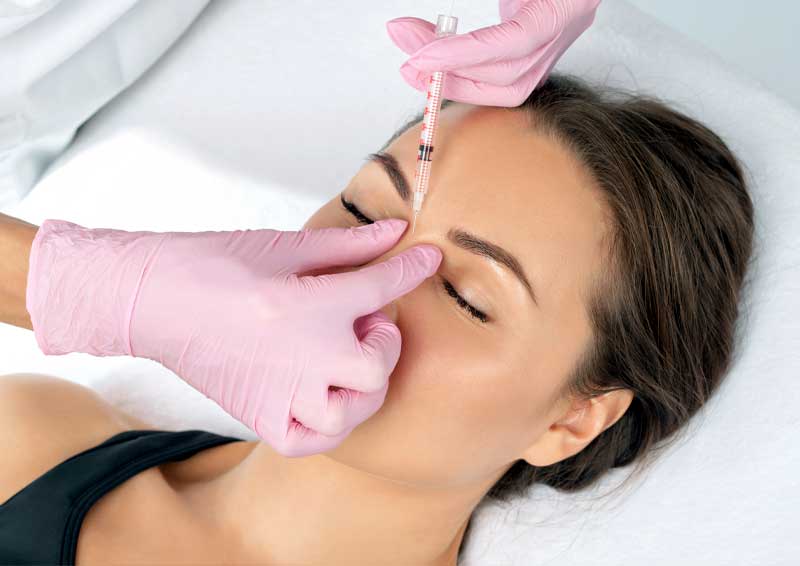 Young woman getting a Xeomin injection