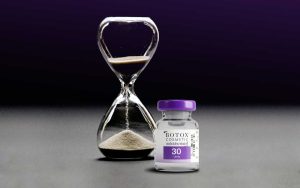 Hourglass and vial of Botox